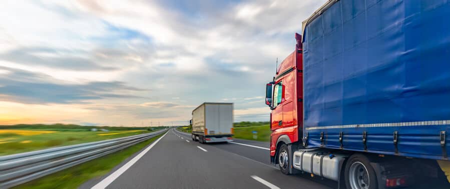 Freight trucks moving on the highway